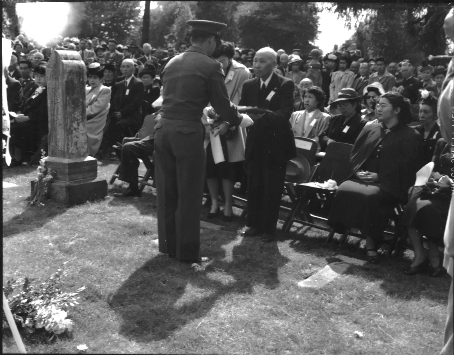 historic photo of ceremony in park honoring Japanese American soldier's service